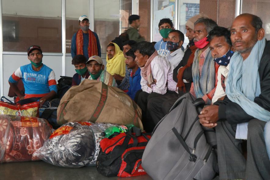 Non local laborers waiting for train inside railwaysation Nowgam
