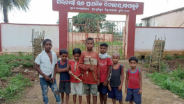Children playing in front of the Dhepagudi UP school in their village in Muniguda